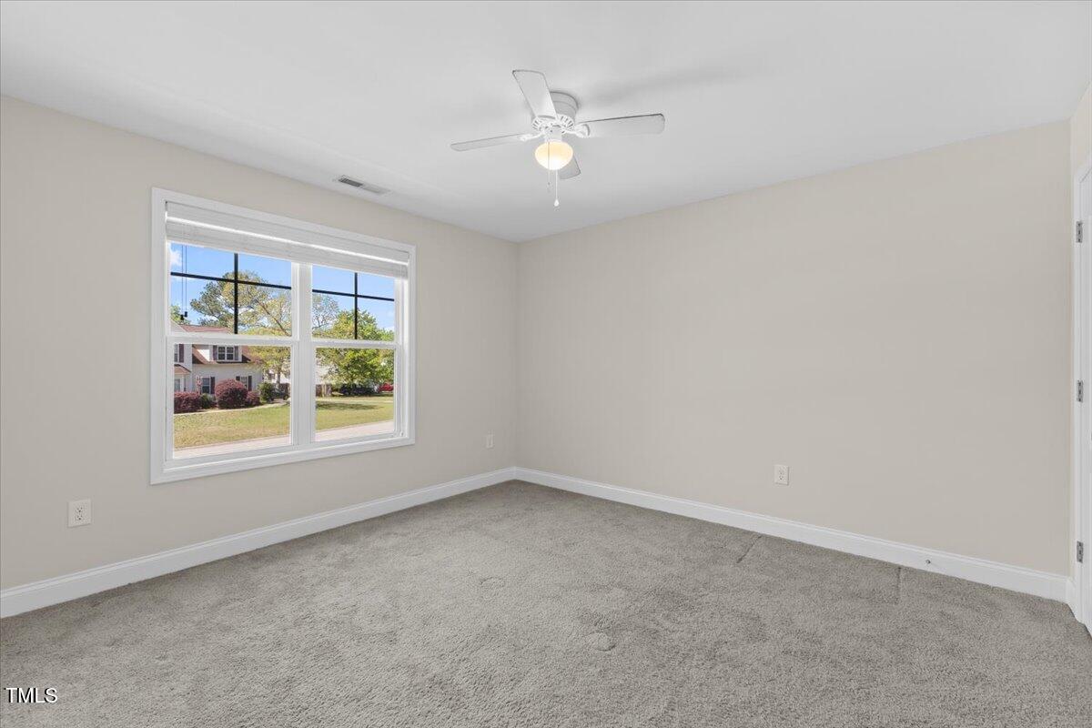166 Old Field Loop Sanford, NC 27332 - Photo 37 of 50 an empty room with a window