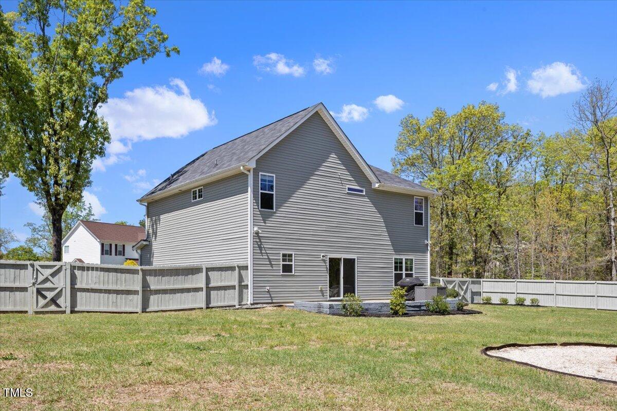 166 Old Field Loop Sanford, NC 27332 - Photo 43 of 50 a view of a house with a yard