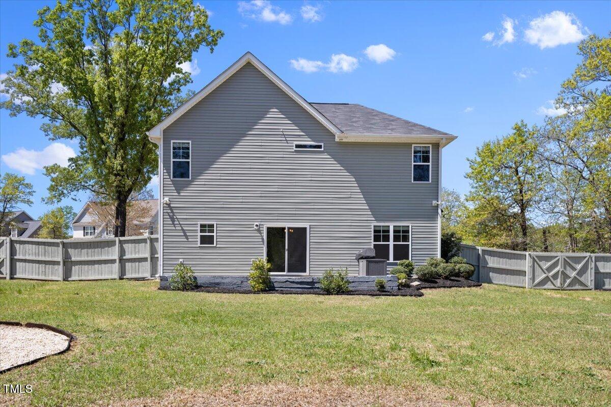 166 Old Field Loop Sanford, NC 27332 - Photo 44 of 50 front view of a house with a yard