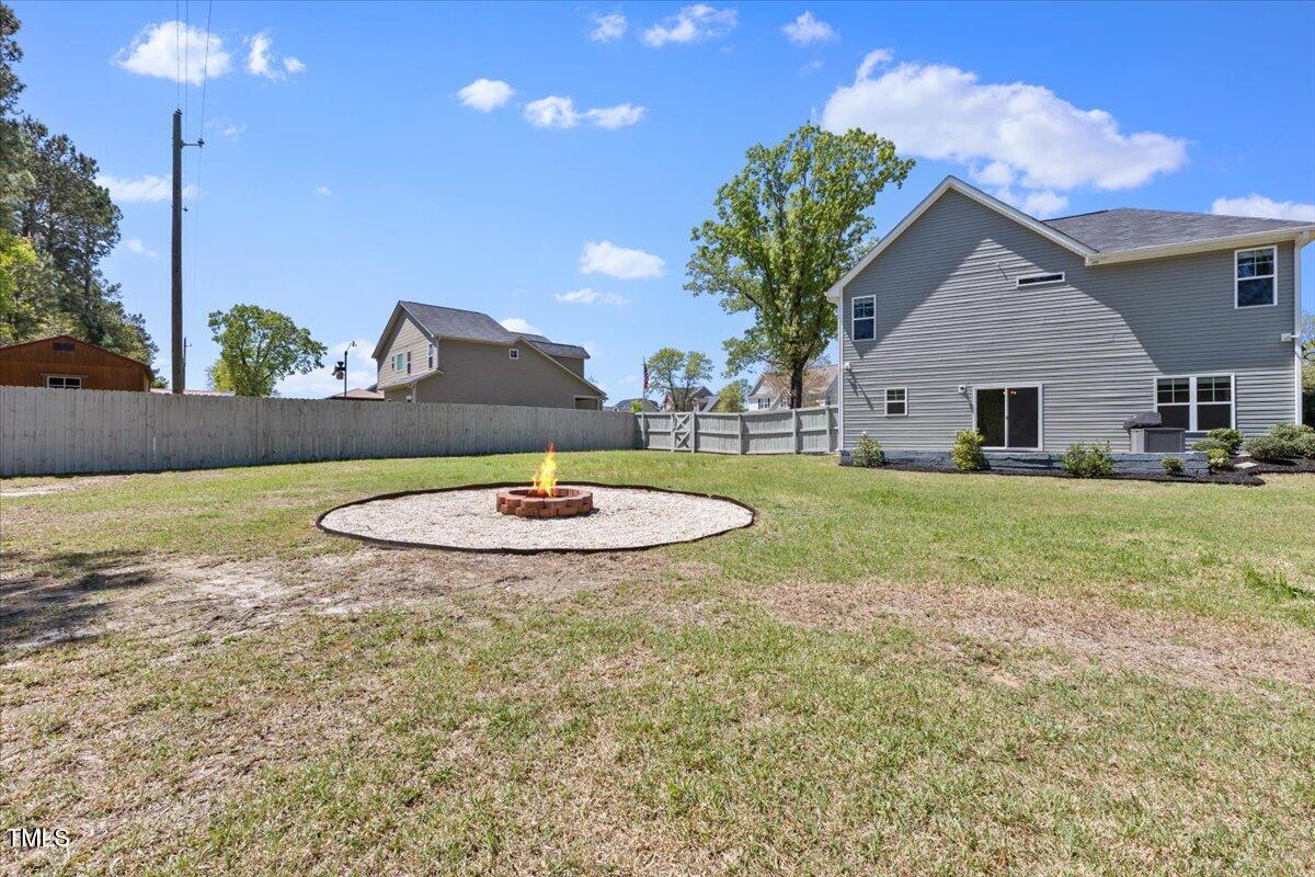 166 Old Field Loop Sanford, NC 27332 - Photo 45 of 50 a view of a house with backyard and sitting area