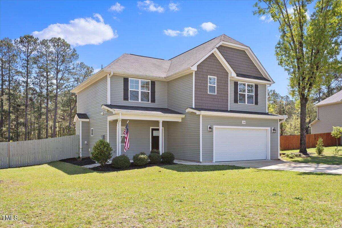 166 Old Field Loop Sanford, NC 27332 - Photo 4 of 50 a front view of a house with a yard