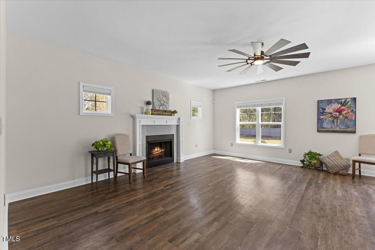 166 Old Field Loop Sanford, NC 27332 - Photo 7 of 50 a living room with furniture and a fireplace