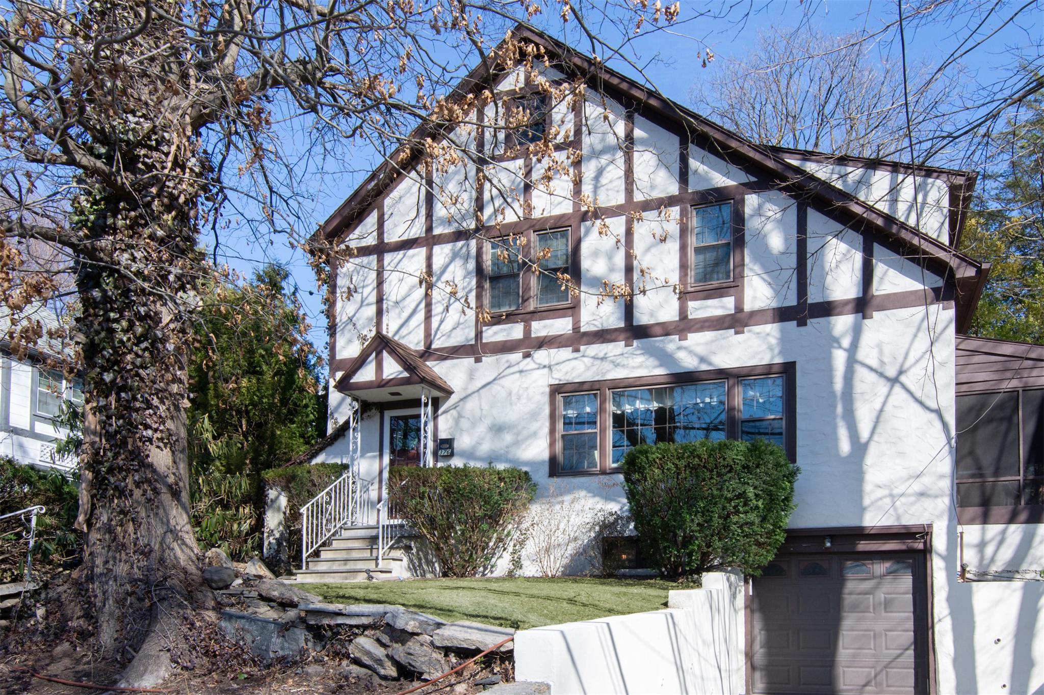 372 Bronxville Road Bronxville, NY 10708 - Photo 1 of 1 English style home featuring stucco siding and a garage