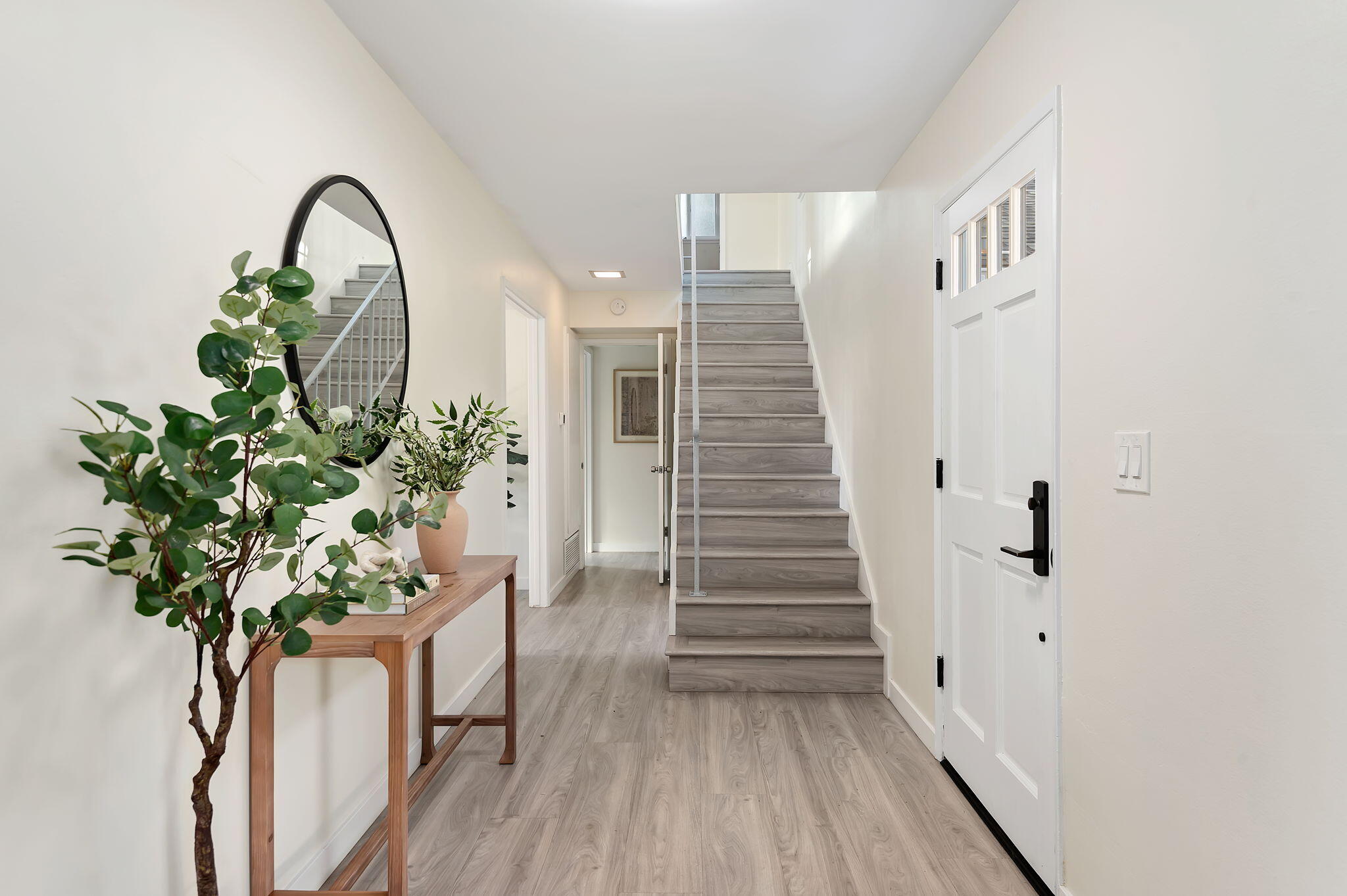 1300 Taranto Circle Carpinteria, CA 93013 - Photo 2 of 10 Bottom Floor Hallway and Stairs