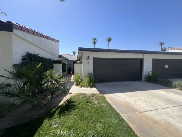 36 El Toro Drive Rancho Mirage, CA 92270 - Photo 1 of 25 a front view of a house with garden