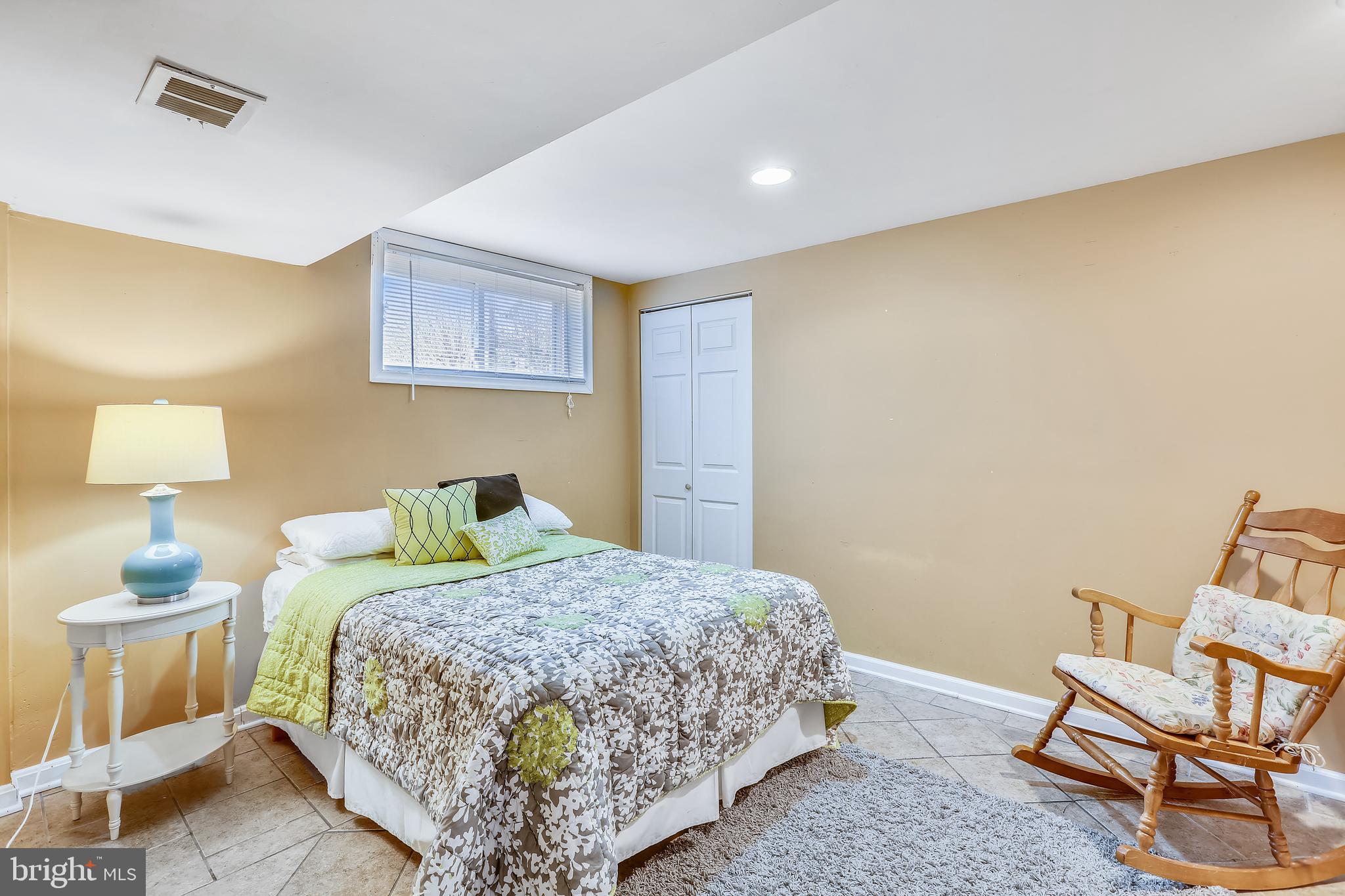 8917 Walden Road Silver Spring, MD 20901 - Photo 26 of 29 Lower level bedroom with closet and windows