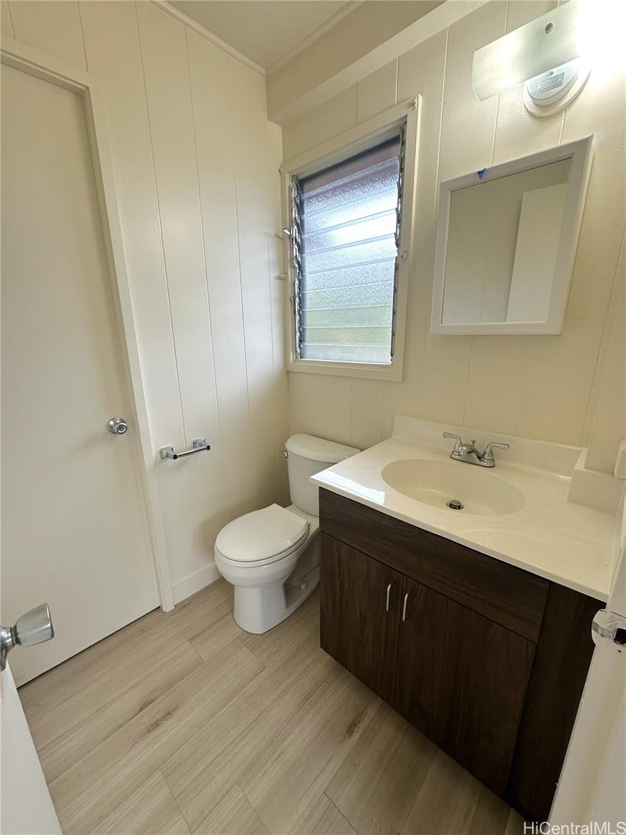 45-038 Waikalua Road Kaneohe, HI 96744 - Photo 14 of 16 a spacious bathroom with a toilet sink and mirror
