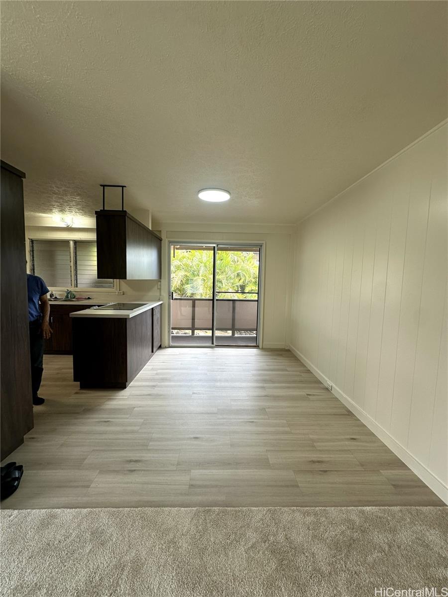 45-038 Waikalua Road Kaneohe, HI 96744 - Photo 7 of 16 a view of a kitchen with a sink and a fireplace