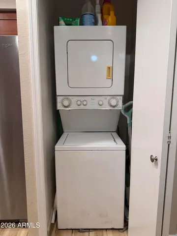 a bedroom with bed and a chandelier