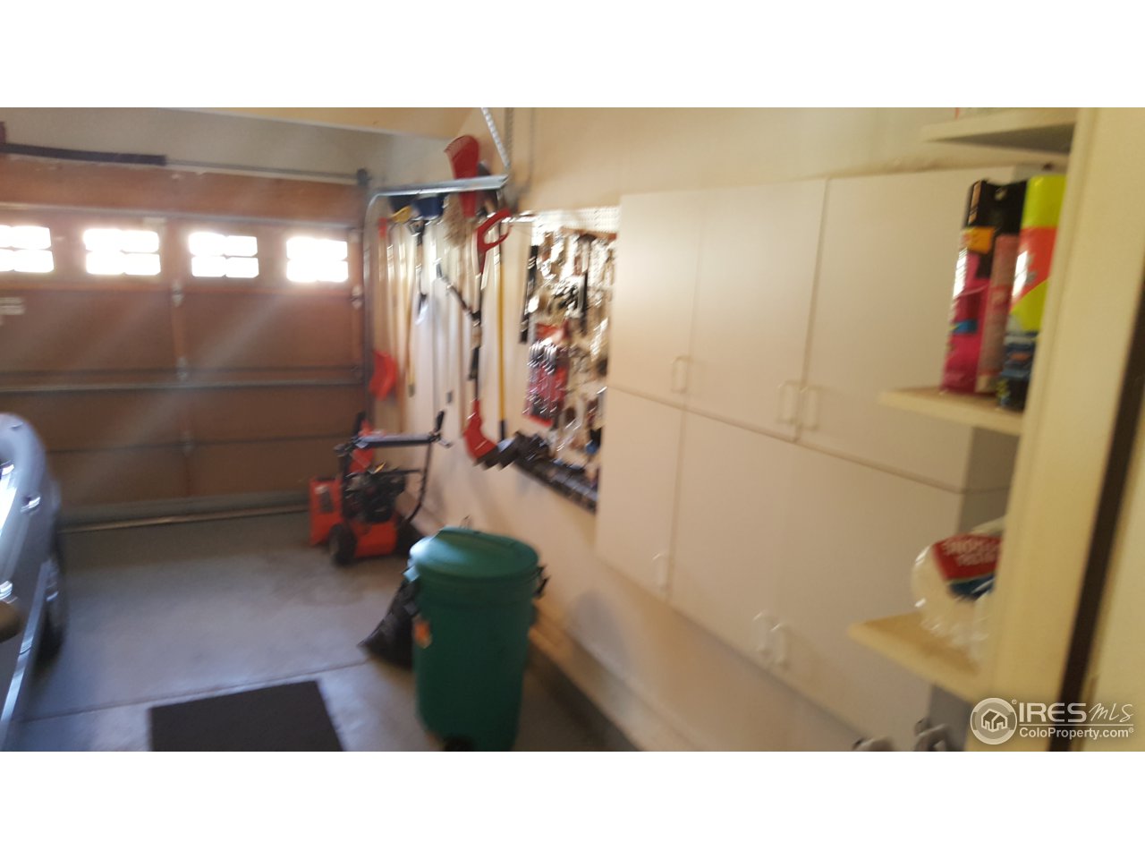 9775 Dampler Way Highlands Ranch, CO 80130 - Photo 10 of 14 Finished garage with cabinetry