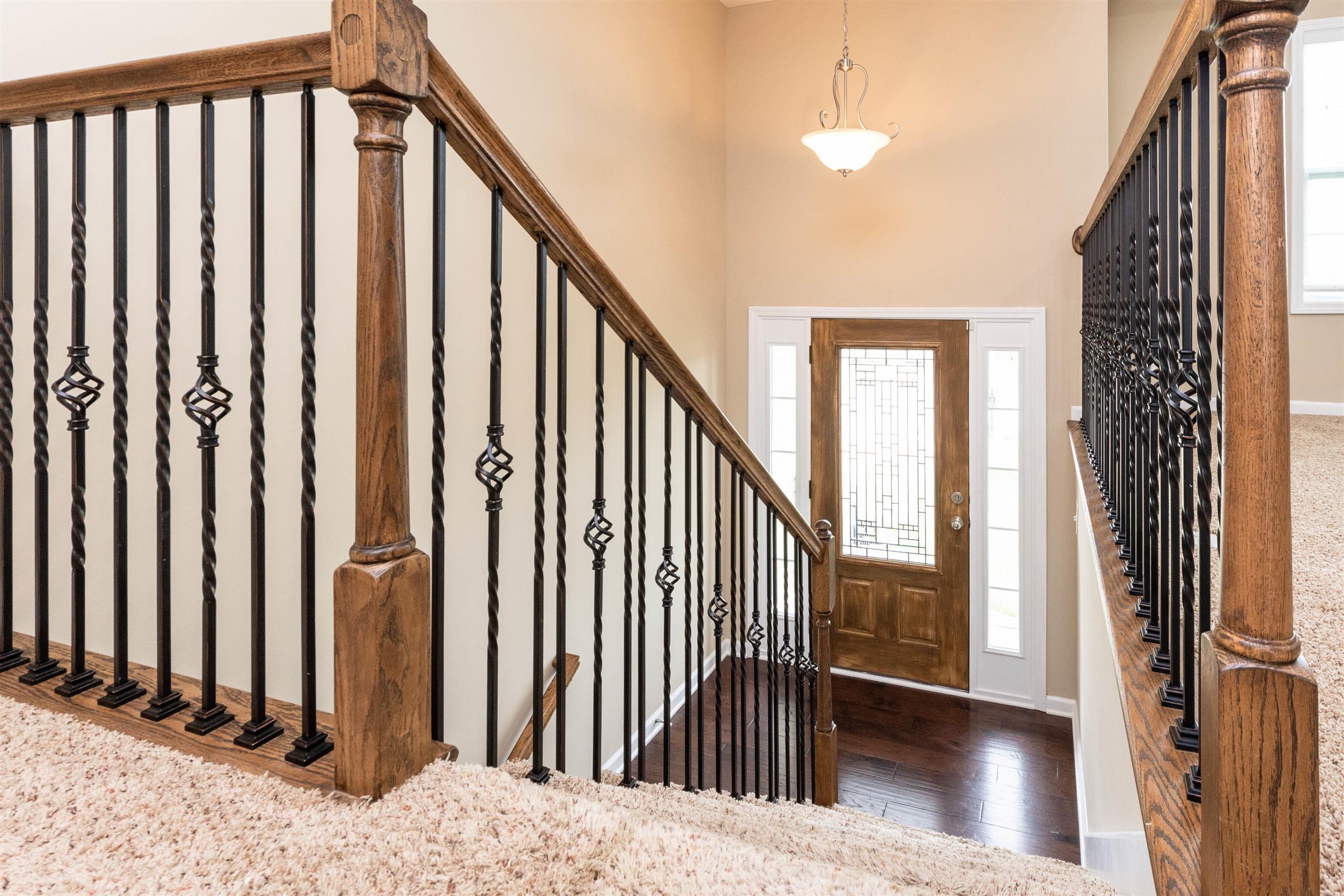 3764 Suiter Road Clarksville, TN 37040 - Photo 2 of 18 a view of a hallway with wooden floor and staircase