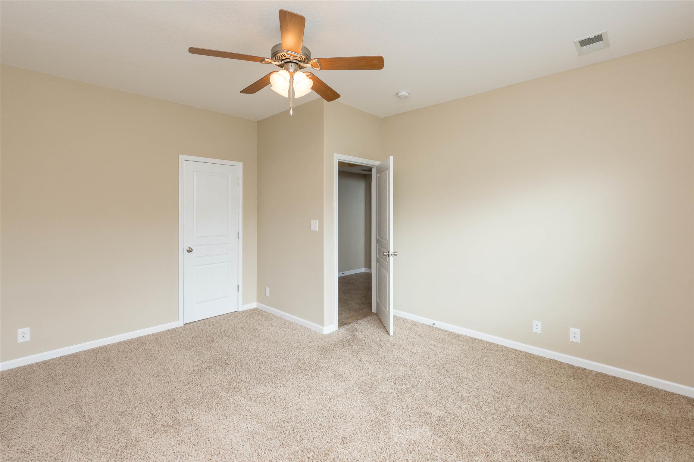 3764 Suiter Road Clarksville, TN 37040 - Photo 13 of 18 an empty room with a ceiling fan and a window