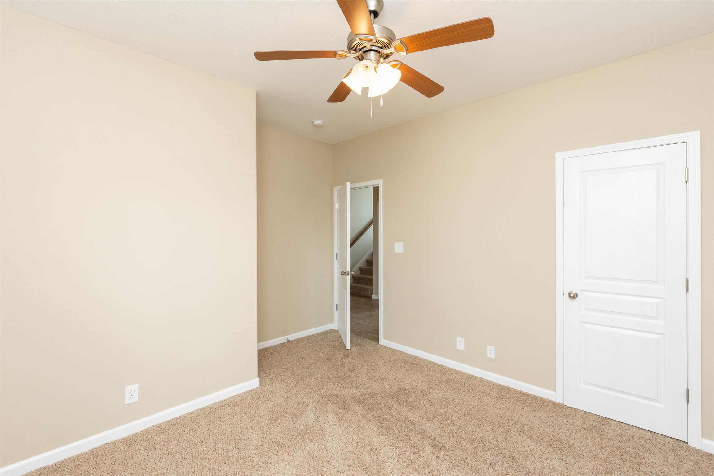 3764 Suiter Road Clarksville, TN 37040 - Photo 14 of 18 an empty room with closet and a ceiling fan