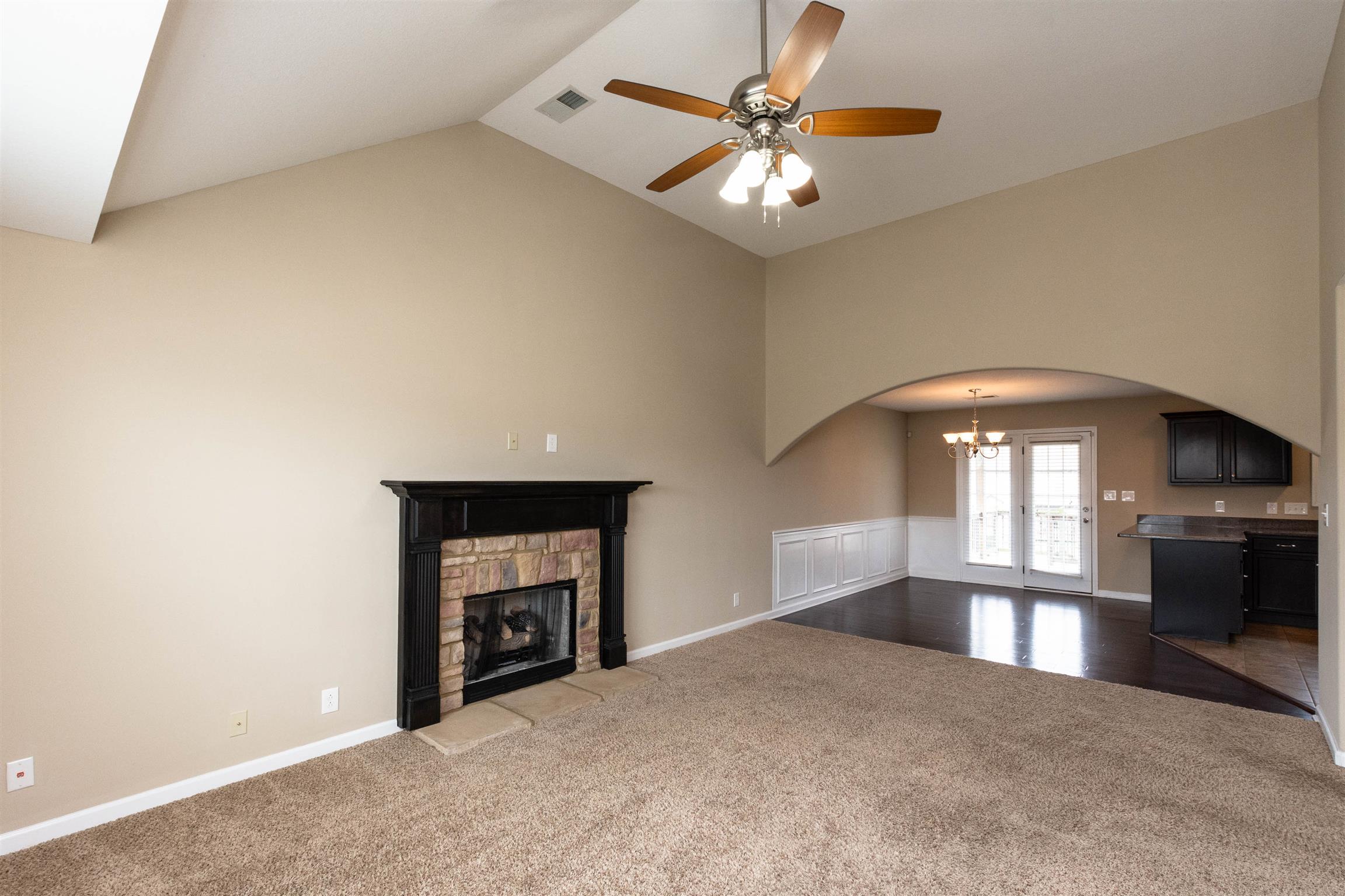 3764 Suiter Road Clarksville, TN 37040 - Photo 3 of 18 an empty room with windows and fireplace
