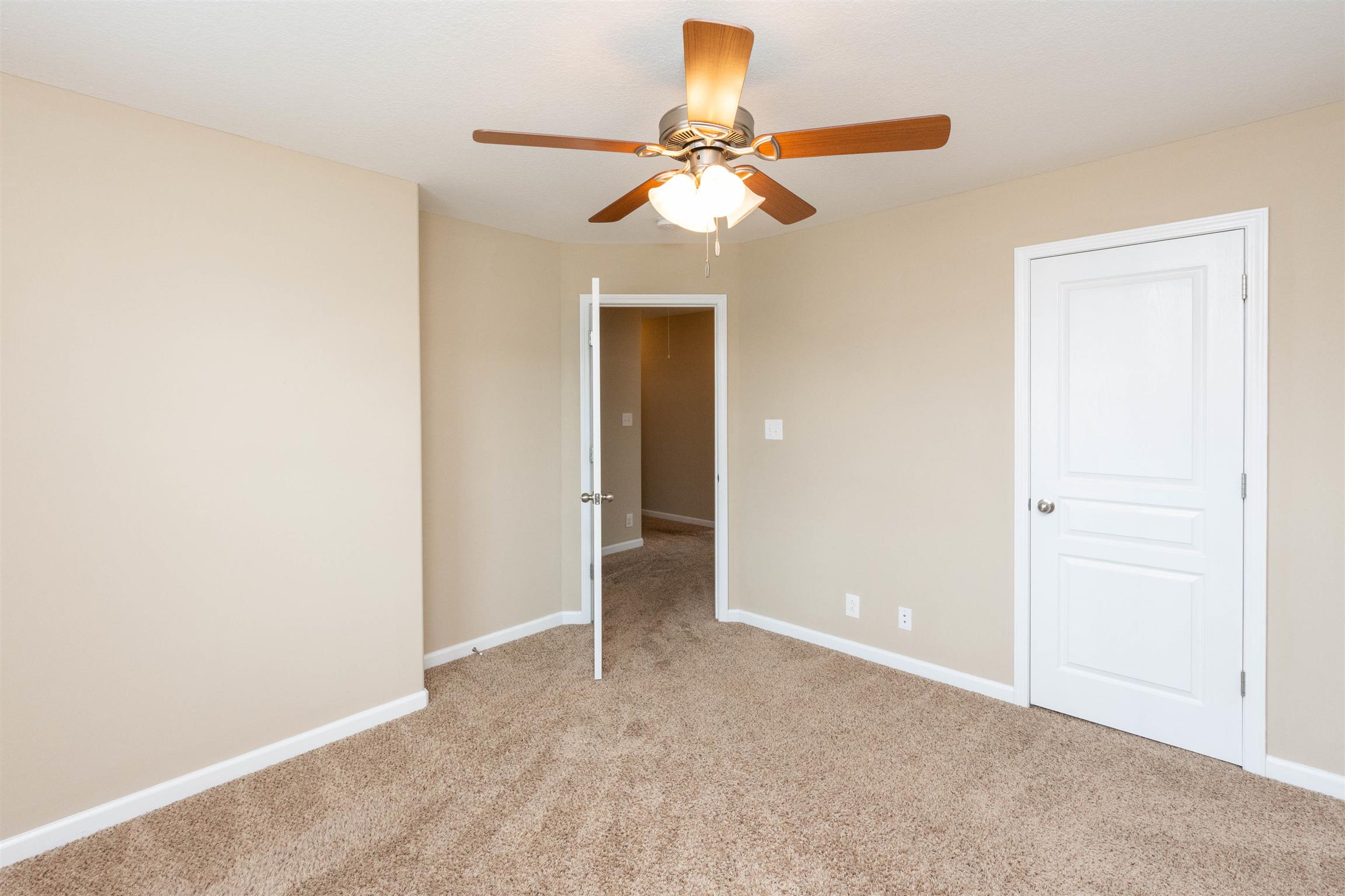 3764 Suiter Road Clarksville, TN 37040 - Photo 8 of 18 an empty room with closet and a chandelier fan