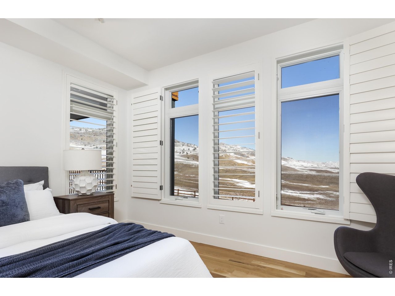 650 Terrace Avenue, Unit E Boulder, CO 80304 - Photo 13 of 44 a bedroom with a large bed and a large window