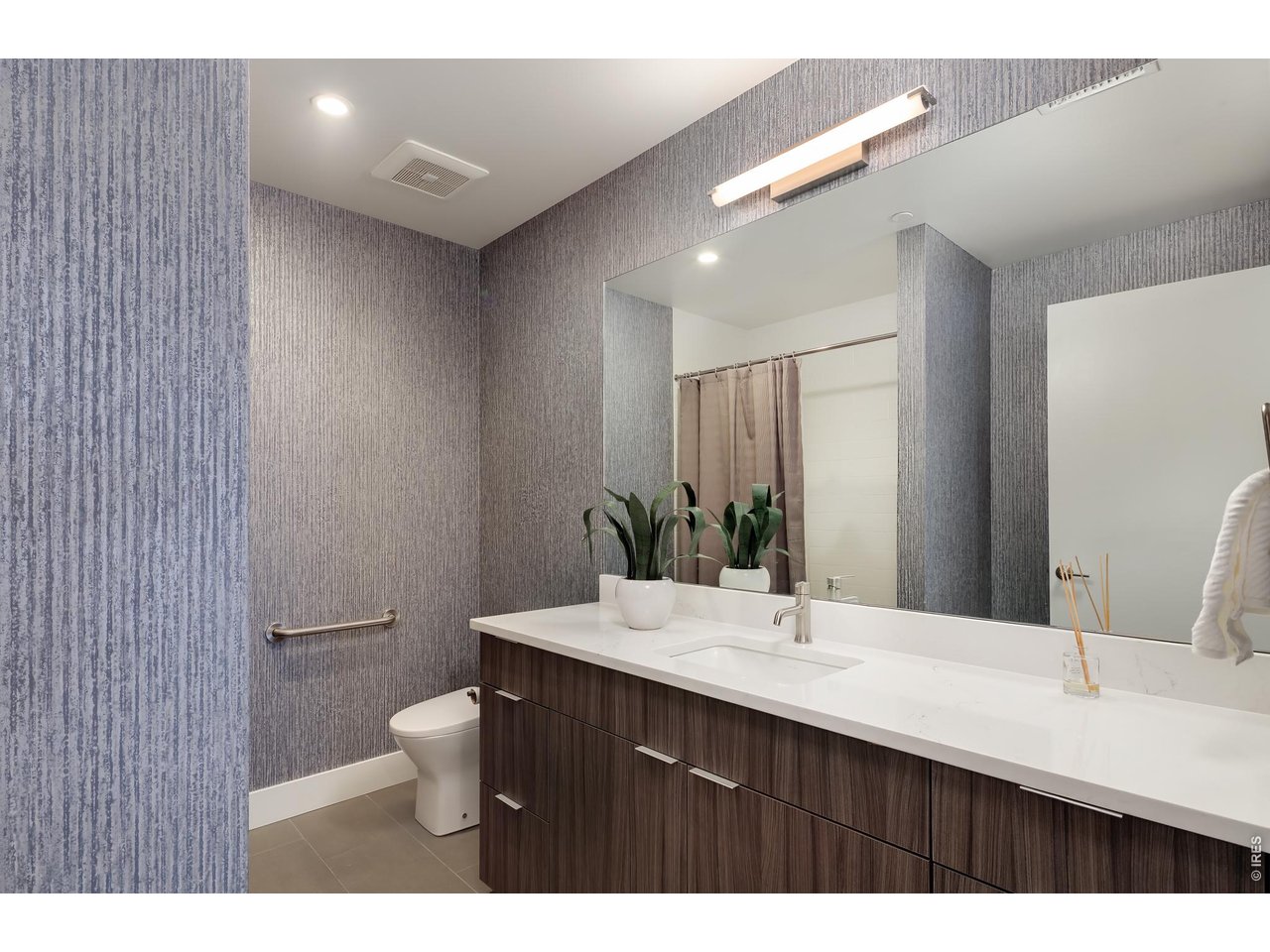650 Terrace Avenue, Unit E Boulder, CO 80304 - Photo 20 of 44 a bathroom with a double vanity sink toilet and mirror