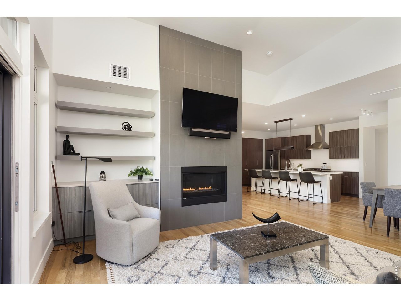 650 Terrace Avenue, Unit E Boulder, CO 80304 - Photo 22 of 44 a living room with furniture a flat screen tv and a fireplace