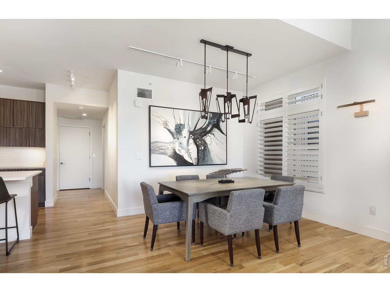 650 Terrace Avenue, Unit E Boulder, CO 80304 - Photo 23 of 44 a view of a dining room with furniture and wooden floor