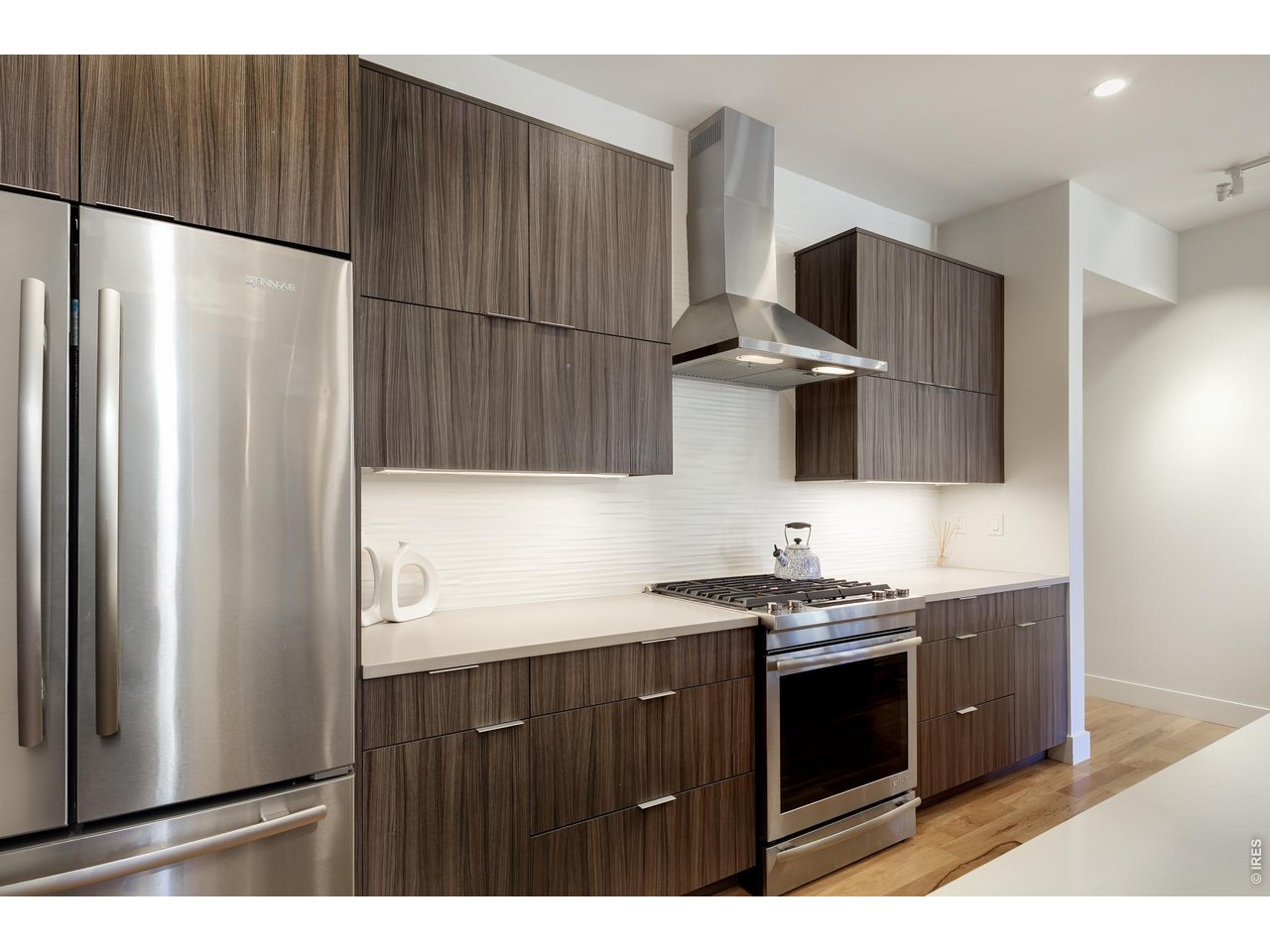 650 Terrace Avenue, Unit E Boulder, CO 80304 - Photo 26 of 44 a kitchen with stainless steel appliances a sink and a refrigerator