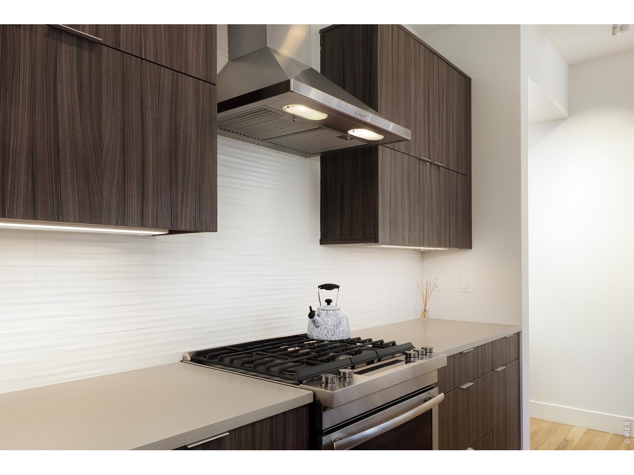 650 Terrace Avenue, Unit E Boulder, CO 80304 - Photo 28 of 44 a kitchen with stainless steel appliances granite countertop a stove and a microwave