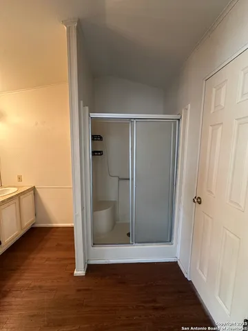 a view of a bathroom with a glass door