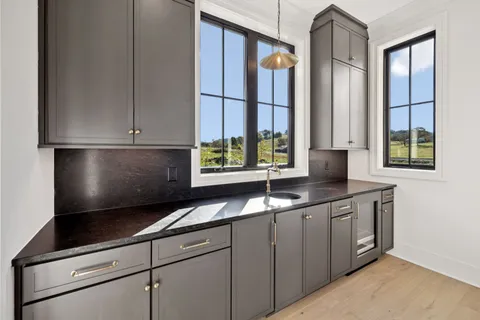 a kitchen with a stove and a microwave