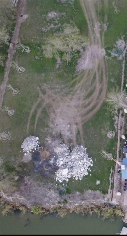 0 East Chimney Road Mission, TX 78572 - Photo 1 of 4 Dock featuring a lawn and a deck with water view