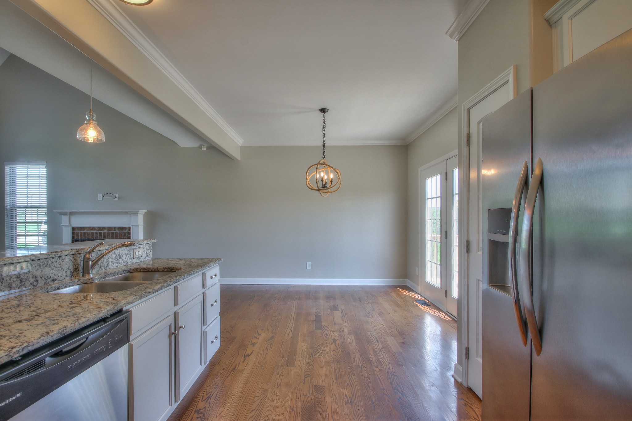 2025 Lincoln Road Spring Hill, TN 37174 - Photo 12 of 37 a kitchen with kitchen island granite countertop a sink window and stainless steel appliances