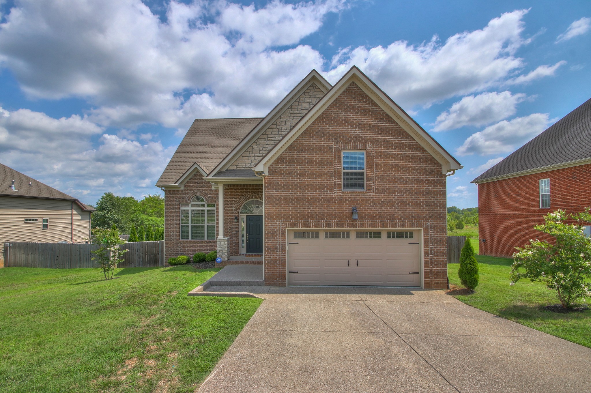 2025 Lincoln Road Spring Hill, TN 37174 - Photo 2 of 37 a front view of house with yard and green space