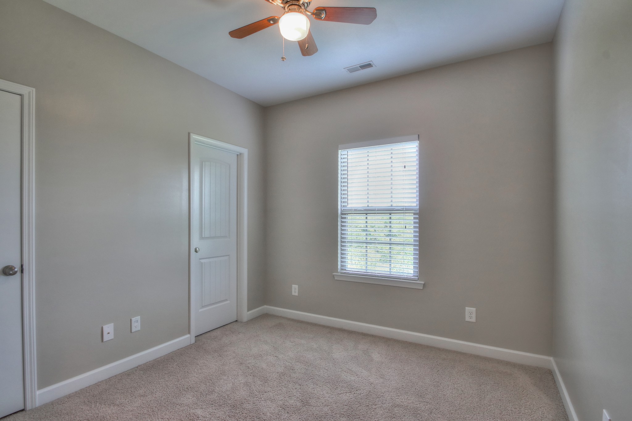 2025 Lincoln Road Spring Hill, TN 37174 - Photo 25 of 37 an empty room with chandelier fan and windows