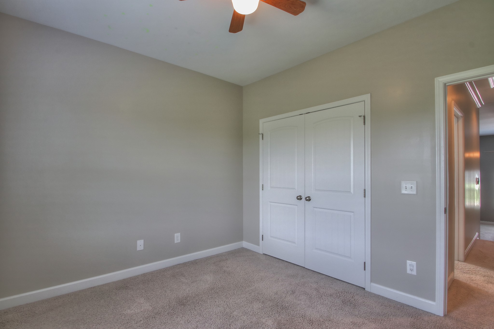 2025 Lincoln Road Spring Hill, TN 37174 - Photo 26 of 37 an empty room with hallway closet and chandelier fan
