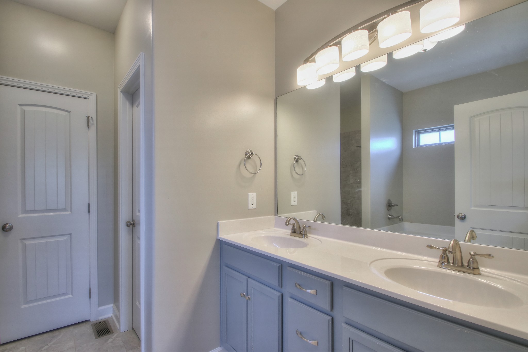 2025 Lincoln Road Spring Hill, TN 37174 - Photo 29 of 37 a bathroom with double vanity sinks and a mirror