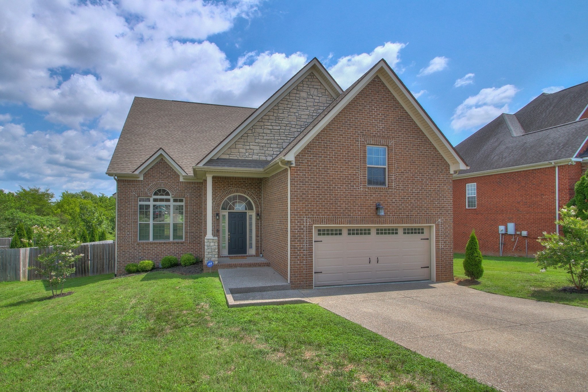 2025 Lincoln Road Spring Hill, TN 37174 - Photo 3 of 37 a view of a house with a yard and garage