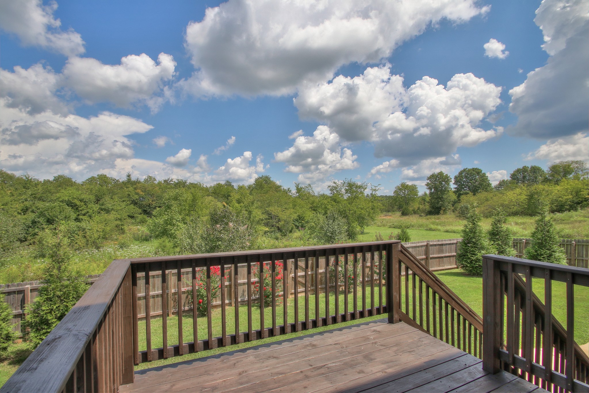 2025 Lincoln Road Spring Hill, TN 37174 - Photo 33 of 37 a balcony with wooden floor and fence