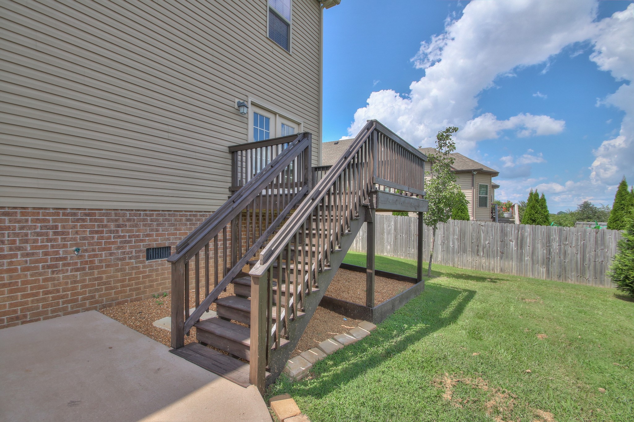2025 Lincoln Road Spring Hill, TN 37174 - Photo 34 of 37 a view of a house with backyard and wooden fence