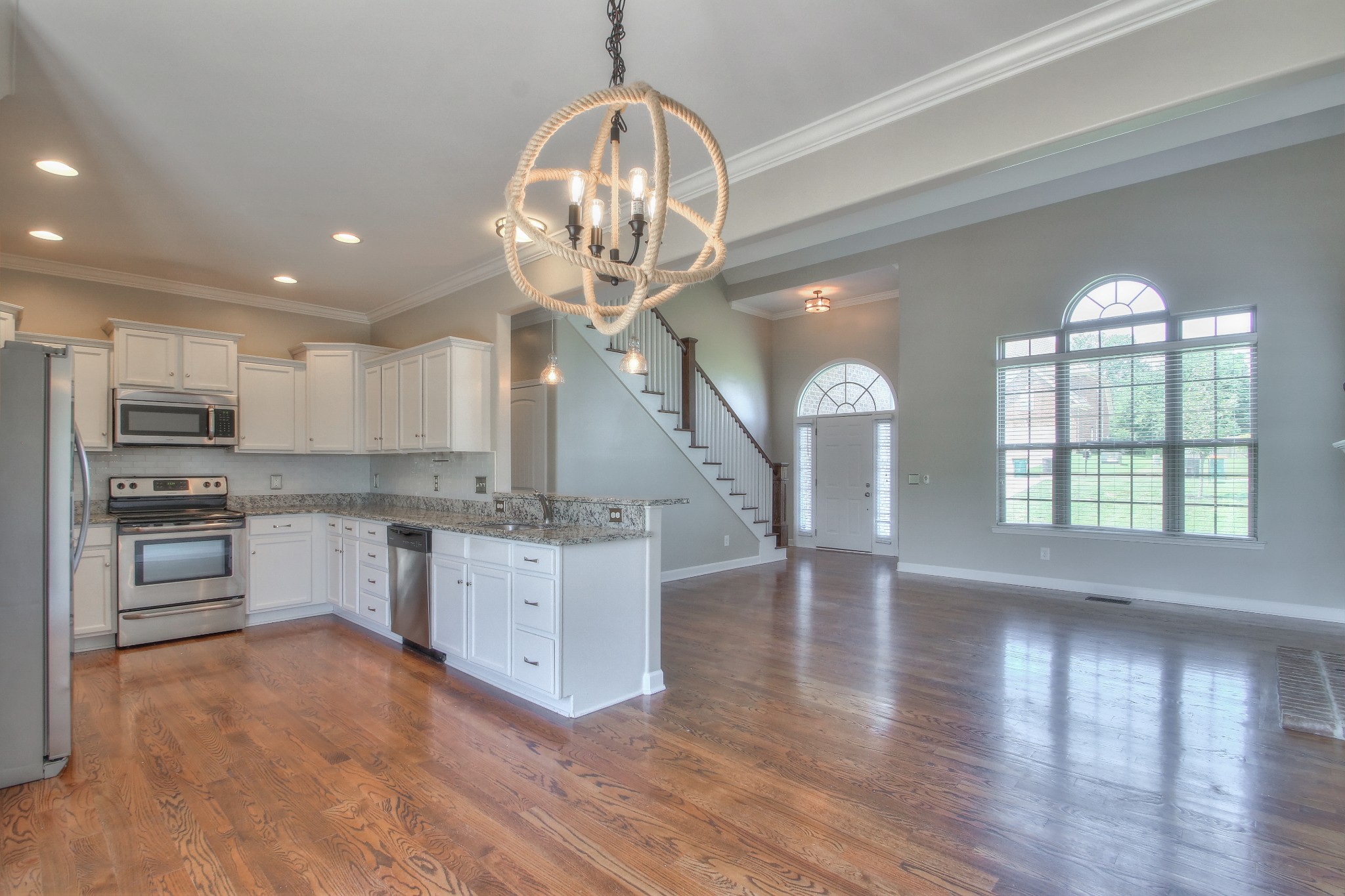 2025 Lincoln Road Spring Hill, TN 37174 - Photo 4 of 37 a large kitchen with stainless steel appliances granite countertop a oven a stove and a refrigerator