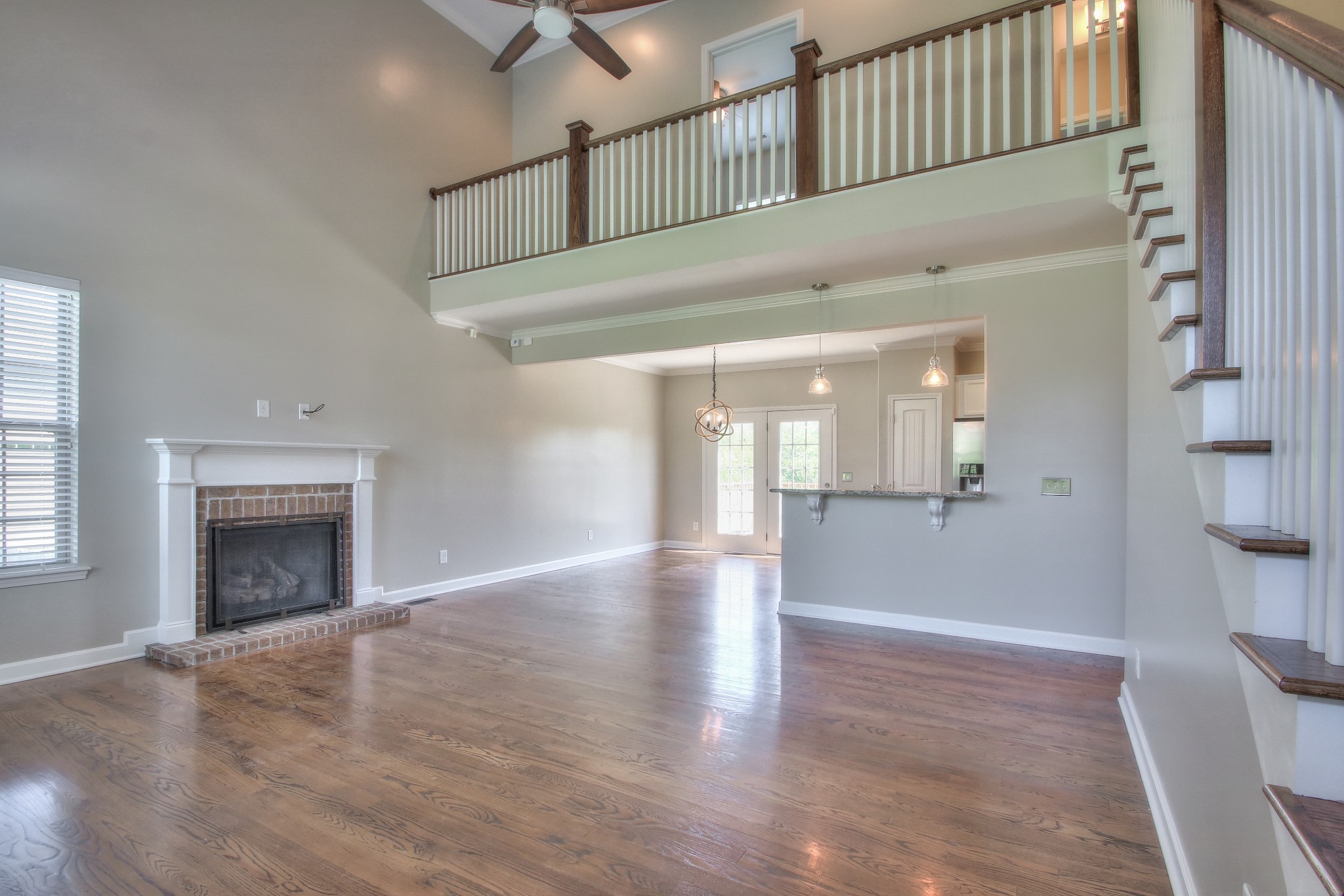 2025 Lincoln Road Spring Hill, TN 37174 - Photo 5 of 37 a view of an empty room with wooden floor and a fireplace