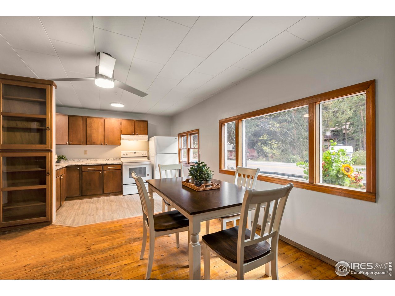 2387 West W Highway Drake, CO 80515 - Photo 12 of 29 a dining room with furniture window wooden floor