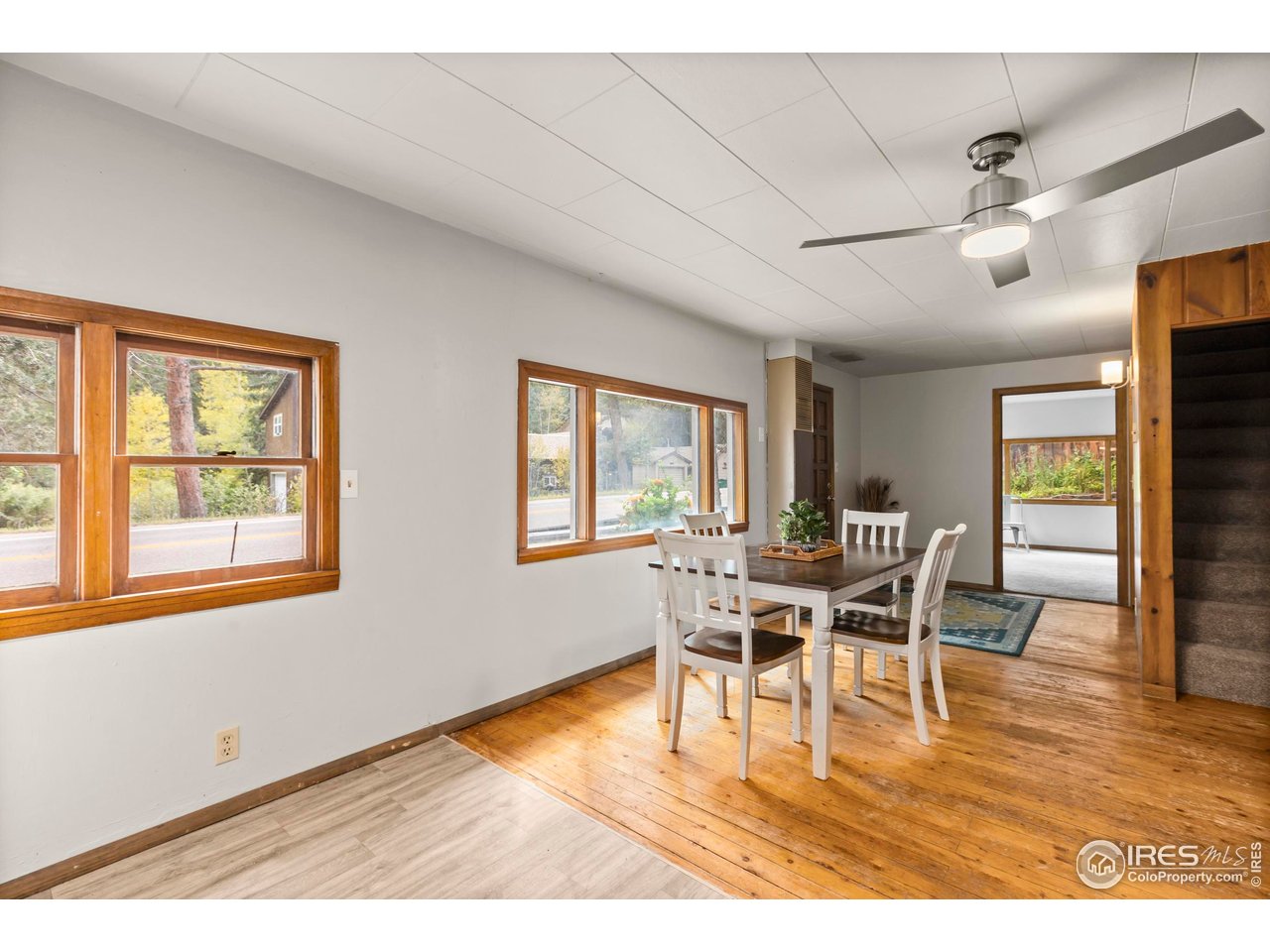 2387 West W Highway Drake, CO 80515 - Photo 14 of 29 a dining room with furniture and wooden floor