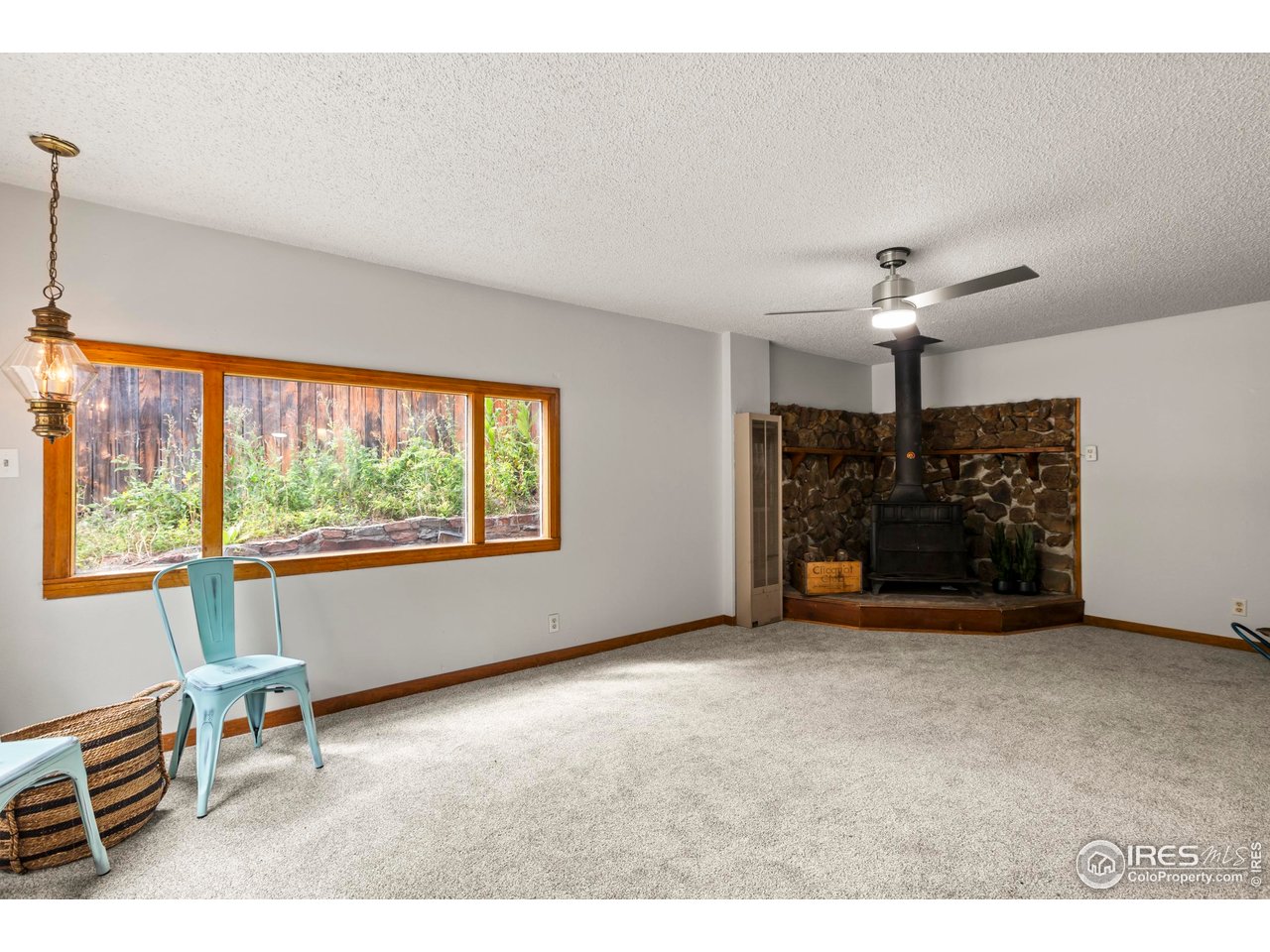 2387 West W Highway Drake, CO 80515 - Photo 17 of 29 a view of a livingroom with furniture chandelier and window