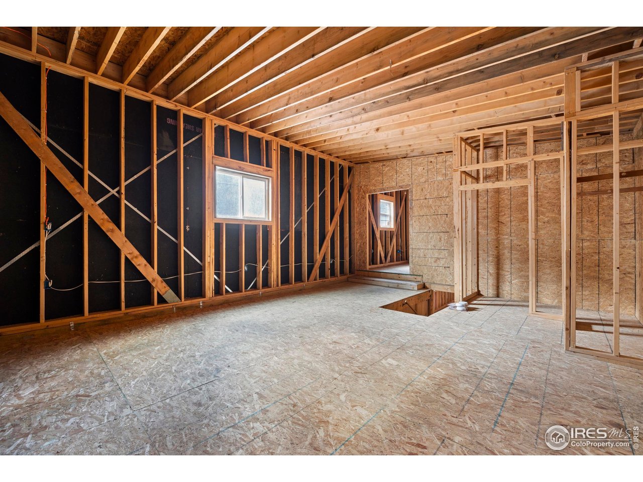 2387 West W Highway Drake, CO 80515 - Photo 29 of 29 a view of an empty room with wooden floor
