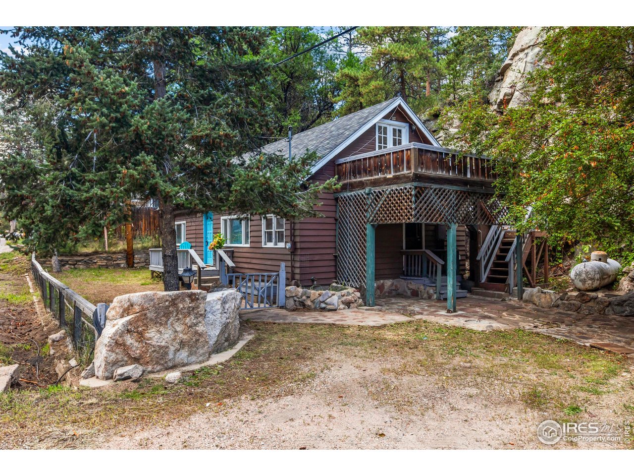 2387 West W Highway Drake, CO 80515 - Photo 3 of 29 a front view of a house with a yard