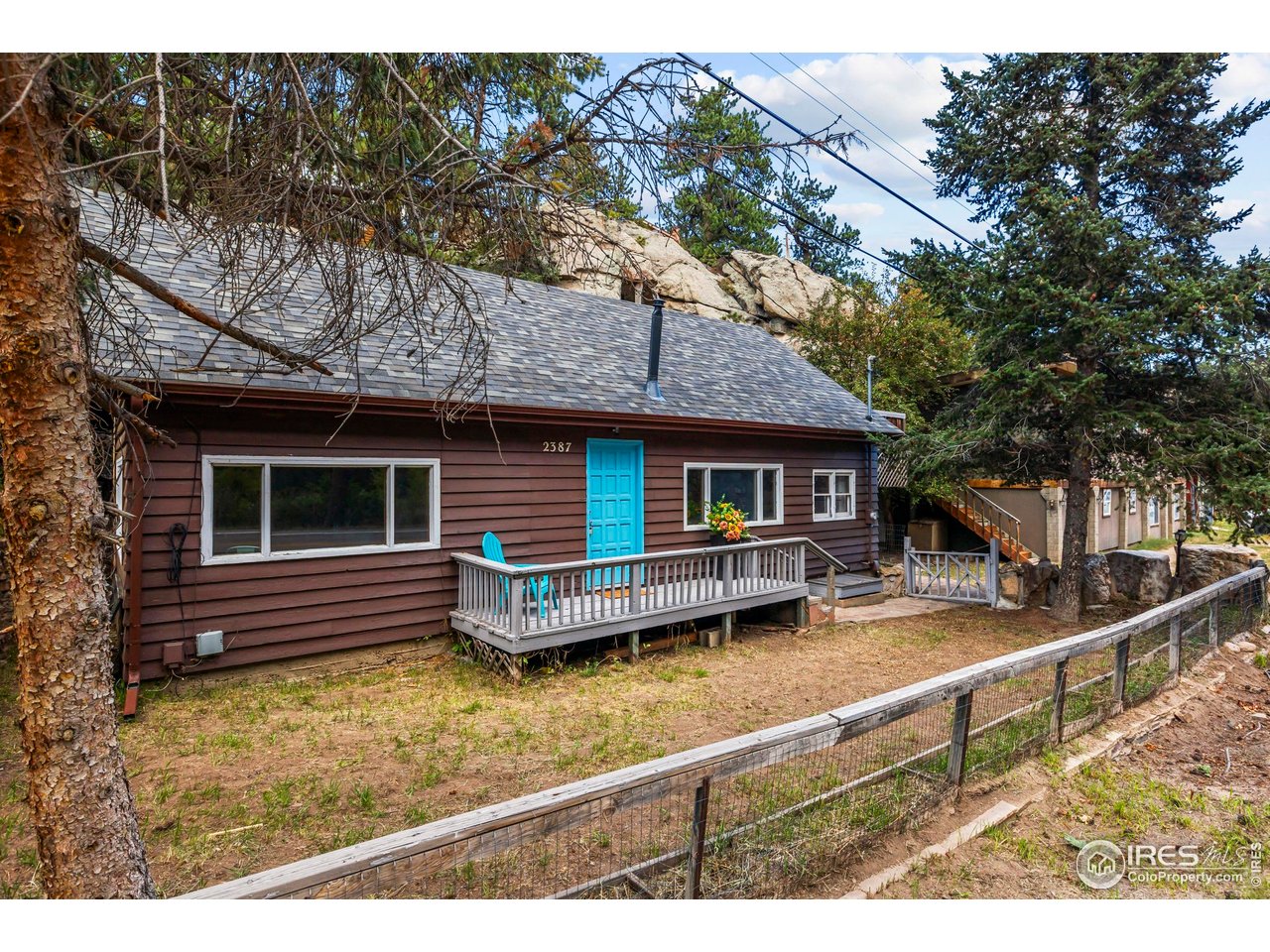 2387 West W Highway Drake, CO 80515 - Photo 6 of 29 a view of house with a yard balcony and furniture