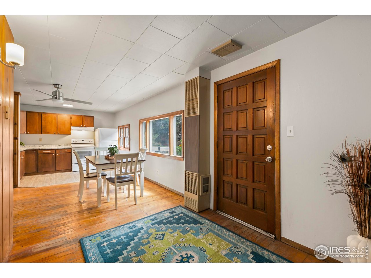 2387 West W Highway Drake, CO 80515 - Photo 10 of 29 a view of a dining room with furniture window and wooden floor