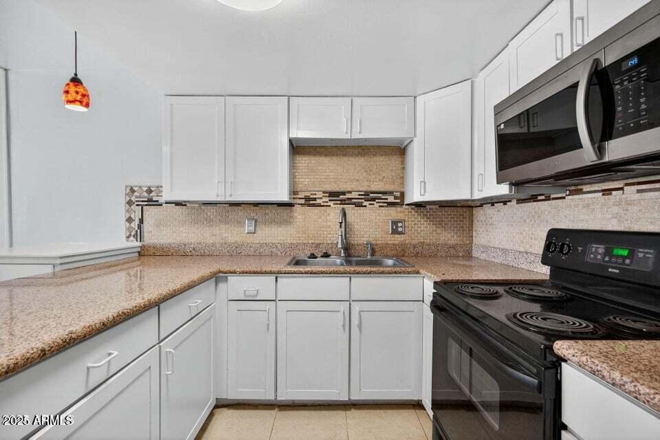 21622 North 23rd Avenue, Unit B 303 Phoenix, AZ 85027 - Photo 2 of 8 23rd Ave Kitchen 2025