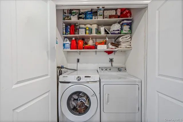 a view of washer and dryer in a utility room