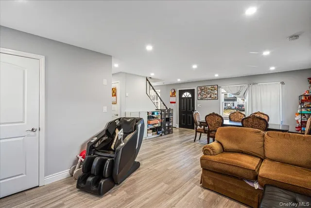 a view of a livingroom with furniture and gym equipment