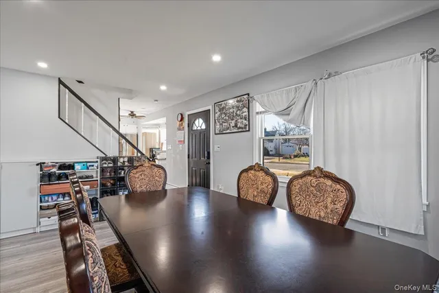 a view of an entryway with wooden floor