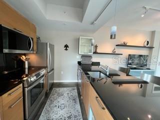 1350 Main Street, Unit 204 Sarasota, FL 34236 - Photo 11 of 22 a kitchen with granite countertop lots of counter top space and stainless steel appliances